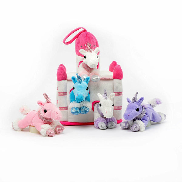 12" Castle House White is a plush castle. The top of the towers are pink while the rest of the castle is white. Next to it are 5 unicorn plushies, one pink, one blue, one white and pink, one white and purple and one purple. 